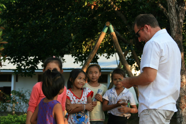 Andrew Brown with children in Laos